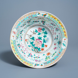 A Chinese famille rose bowl with birds among blossoming branches, 19th C.