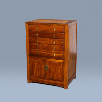 A Chinese wood chest with five drawers, 20th C.