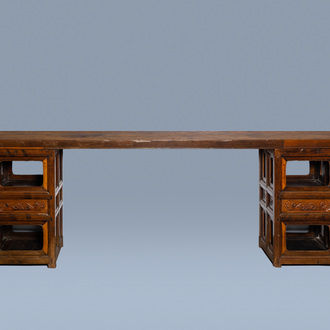 A long Chinese wood console table, 20th C.