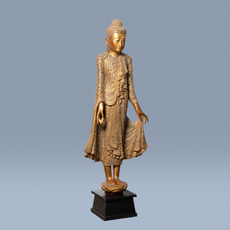 A tall inlaid gilt wood figure of a standing Buddha, Thailand, 20th C.
