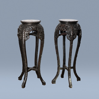 Two Chinese carved wood stands with marble top, 19th/20th C.