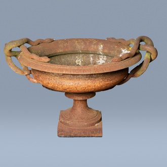 An imposing French or English cast iron garden planter or vase with intertwined snake handles, 19th C.