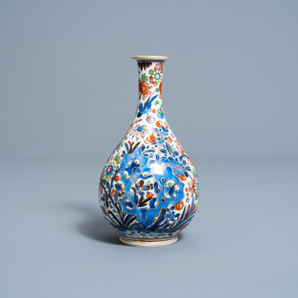 A clobbered Chinese blue and white vase with birds among flowers, Kangxi