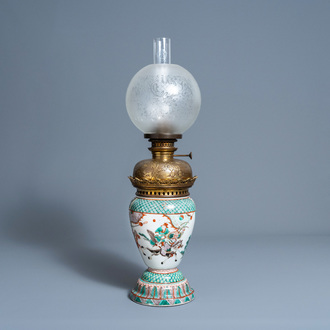 A Chinese famille verte vase with figurative design all around mounted as a lamp, 19th/20th C.