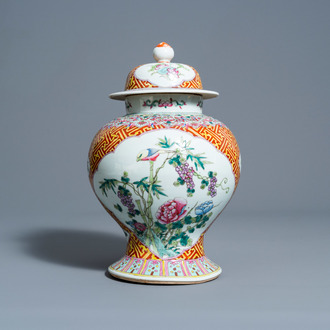 A Chinese famille rose vase and cover with birds among blossoming branches, 19th C.