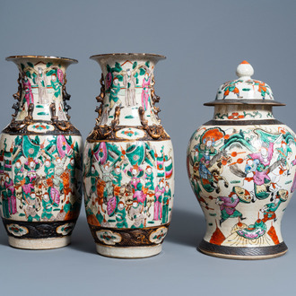 A pair of Chinese Nanking crackle glazed famille rose vases and a vase and cover with warrior scenes, 19th/20th C.