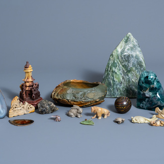 A varied collection of carved and uncarved gemstones and soapstones, mainly China, 20th C.