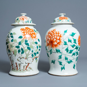 Two Chinese famille rose 'peonies' vases and covers, 19th C.