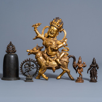 A Sino-Tibetan gilt bronze figure of Mahakala on horseback, a bronze bell and three various Indian sculptures, 19th/20th C.