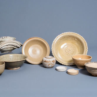 A varied collection of Asian cream glazed ceramics, a.o. China and Southeast Asia, possibly Song and later
