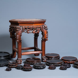 A collection of Chinese carved wood stands, one of which with marble top, 19th/20th C.