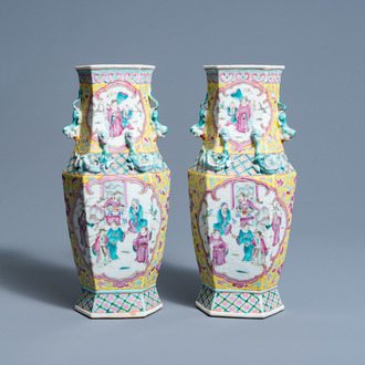 A pair of hexagonal Chinese famille rose vases with figures in a garden, 19th C.