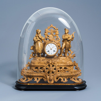 A French gilt zamac mantel clock with a romantic scene with accompanying bell jar, 19th C.