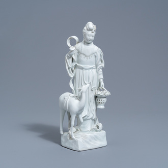 A Chinese Dehua blanc de Chine figure of Magu with a deer, 20th C.