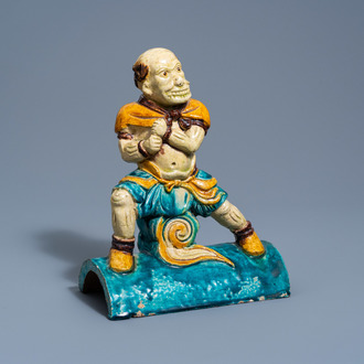 A Chinese turquoise and yellow glazed 'warrior' roof tile, probably Ming