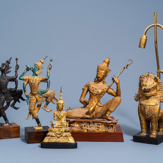 Three Thai patinated and gilt bronze figures of musicians, a temple lion and a Buddha, 20th C.