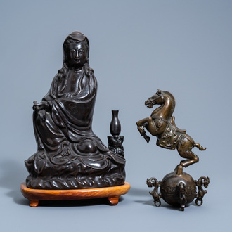A Chinese bronze figure of Guanyin and a horse, 19th/20th C.