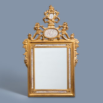 A historicizing gilt mirror, 20th C.