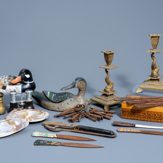 A varied collection of decorative objects, a.o. a pair of candlesticks, binoculars, letter openers and ducks, various origins, 19th/20th C.