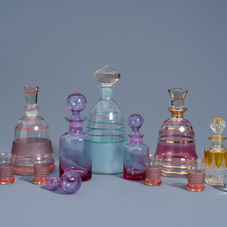 A varied collection of carafes, some stoppers and four glasses in partly coloured glass, various origins, 20th C.