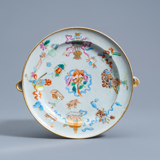 A Chinese Canton famille rose 'antiquities' warming plate, 19th C.