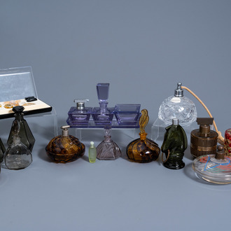 A varied collection of glass and crystal perfume bottles and a toilet set, various origins, a.o. Val Saint Lambert, 20th C.