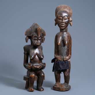 A carved wooden 'phemba' or maternity group and a figure of a lady, Yombe, Congo, 20th C.