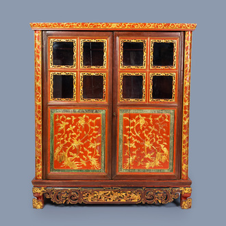 A Chinese Straits or Peranakan market gilt and lacquered wood two-door cabinet, 19th C.
