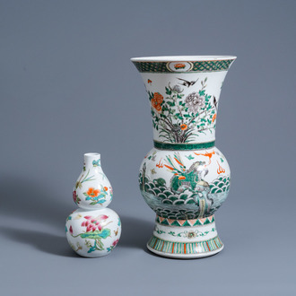 A Chinese famille verte yenyen vase with animals and floral design and a famille rose double gourd vase with insects among branches, 20th C.