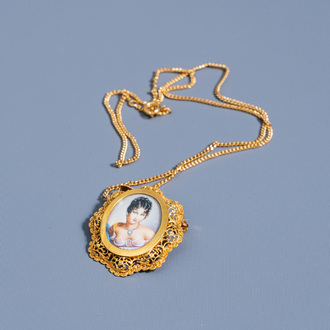 An 18 carat yellow gold necklace with a miniature of a lady, 20th C.