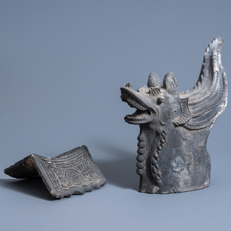 Two Chinese black earthenware roof tiles, one in the shape of a dragon, ca. 1900