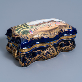 A gold layered blue ground box and cover in the Sèvres manner with strolling citizens, 20th C.