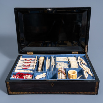 A Chinese Canton lacquer playing box with ivory pieces, 19th C.