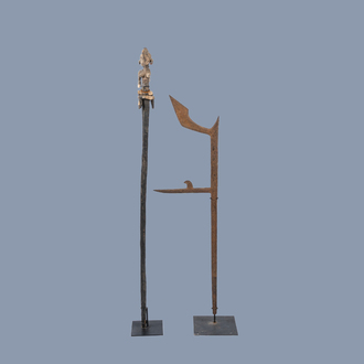 An African traditional weapon and a staff with an enthroned figure as crowning, 19th/20th C.