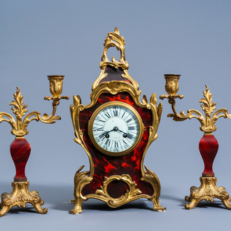A French gilt bronze mounted and tortoiseshell veneered Louis XV style three-piece clock garniture, 19th/20th C.