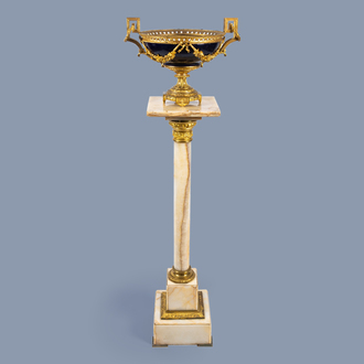 An gilt mounted onyx marble pedestal and a gilt bronze mounted bowl in the Sèvres manner with floral design, 20th C.