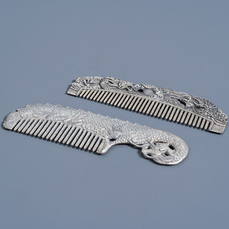 Two Chinese silver plated combs with dragons and a phoenix, 20th C.