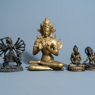 Four various Sino-Tibetan brass and bronze figures, 20th C.