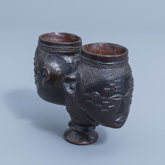 A finely carved Congolese two-headed or double wooden Kuba cup with a dark brown patina, first half of the 20th C.