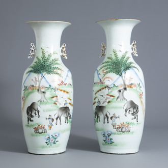 A pair of Chinese qianjiang cai vases with figures and water buffaloes in a landscape, 19th/20th C.