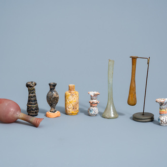 A varied collection of glass bottles and flasks, possibly Roman period