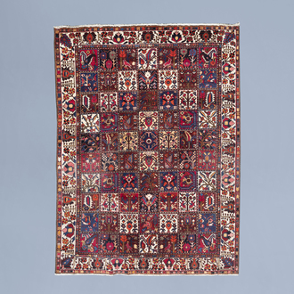 An Oriental Bakhtiari rug with typical 'garden compartment' design, wool on cotton, Persia, mid 20th C.