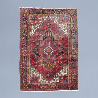 An Oriental Heriz rug with floral design, wool on cotton, Persia, mid 20th C.