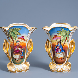 A pair of gilt and polychrome old Paris porcelain vases with floral relief and chinoiserie design, dated 1853