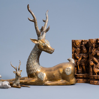 Three Indian brass and silver-plated metal models of deer and a pair of wood panels with dancers, 20th C.