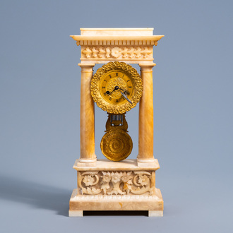 A French bronze and alabaster column mantel clock with floral design, 19th C.