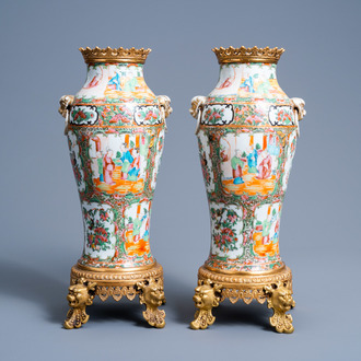 A pair of Chinese Canton famille rose brass mounted baluster vases, 19th C.