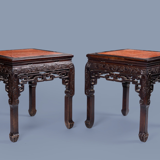 A pair of Chinese wood side tables with marble top, 20th C.