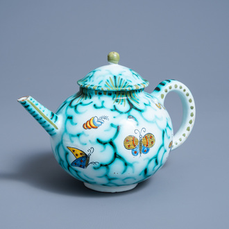 A Brussels faience teapot and cover with butterflies and caterpillars, 20th C.