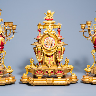A French gilt bronze Sèvres style porcelain three-piece clock garniture with sphinxes, late 19th C.